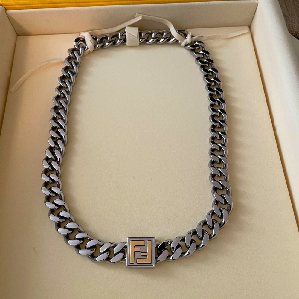 White and silver Fendi necklace.